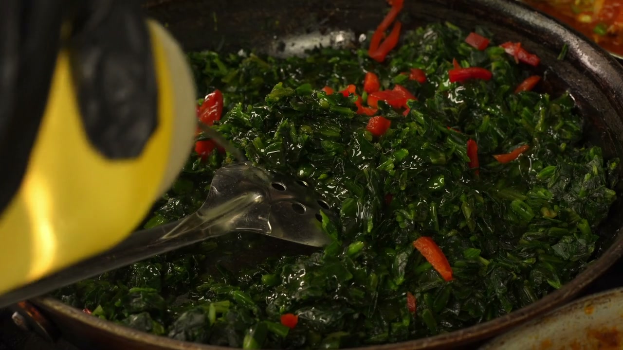 Greens cooking in the Shebelle kitchen